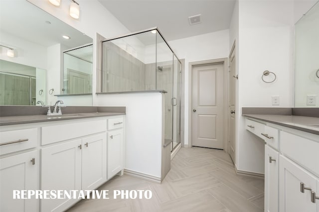 bathroom featuring vanity and walk in shower