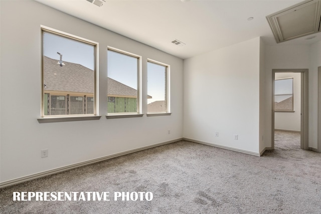 empty room featuring light colored carpet