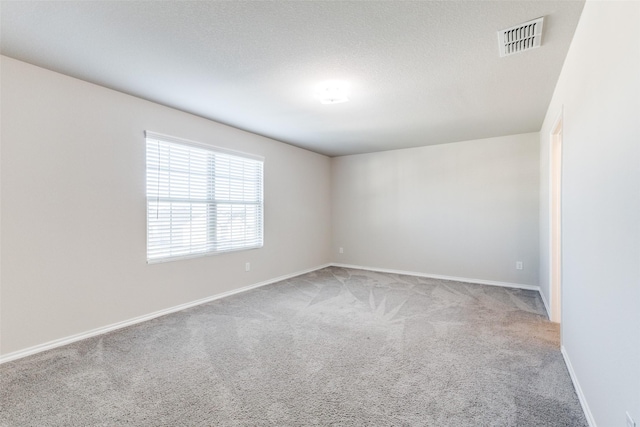 unfurnished room featuring carpet floors