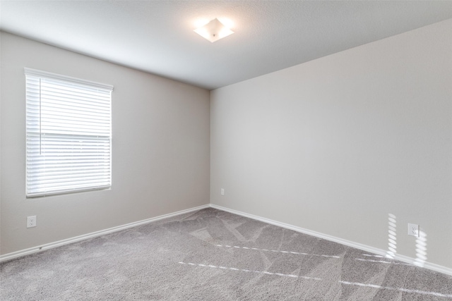 empty room with carpet and a healthy amount of sunlight