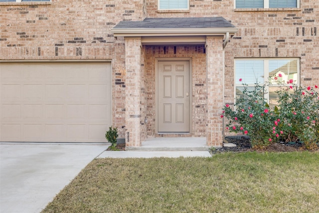 doorway to property with a garage