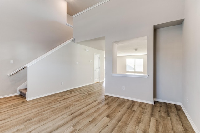 unfurnished living room with light hardwood / wood-style flooring