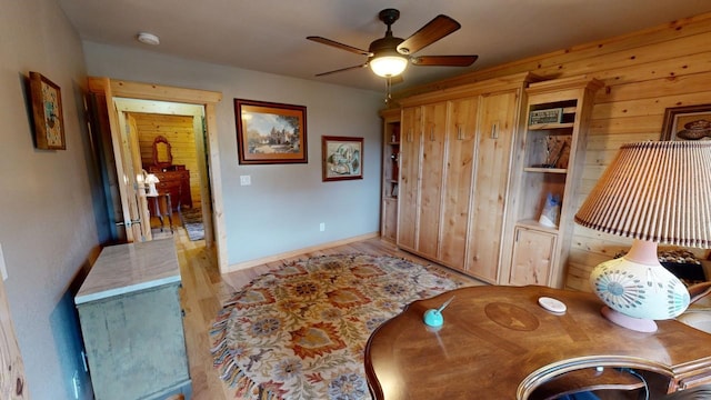 interior space with ceiling fan and light hardwood / wood-style floors