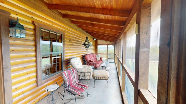 sunroom / solarium with vaulted ceiling with beams and wood ceiling