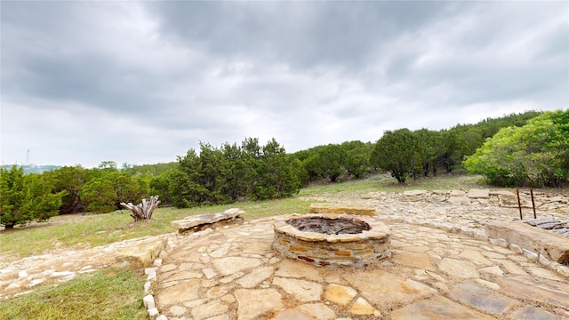 view of patio / terrace featuring an outdoor fire pit