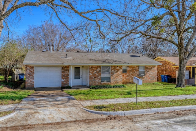 ranch-style home with a garage and a front lawn