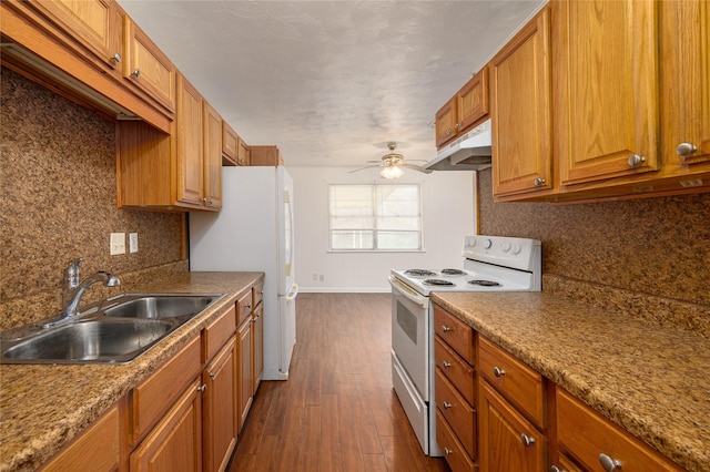 kitchen with tasteful backsplash, white appliances, ceiling fan, sink, and dark hardwood / wood-style floors