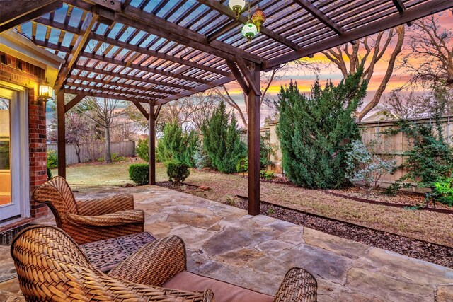 patio terrace at dusk with a pergola