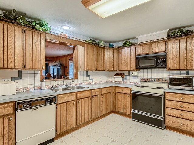 kitchen featuring white dishwasher, electric stove, sink, a textured ceiling, and tasteful backsplash