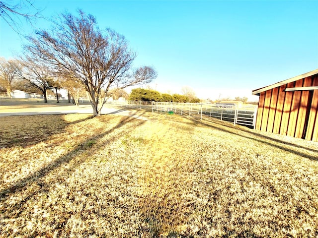 view of yard with a rural view