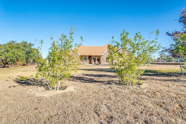 back of house featuring a lawn