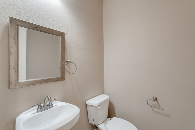 bathroom with sink and toilet