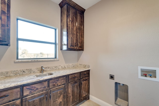 washroom featuring electric dryer hookup, cabinets, sink, and hookup for a washing machine