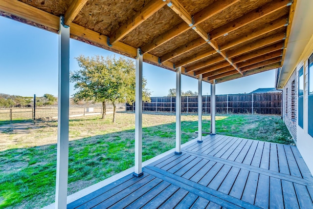 wooden terrace with a yard