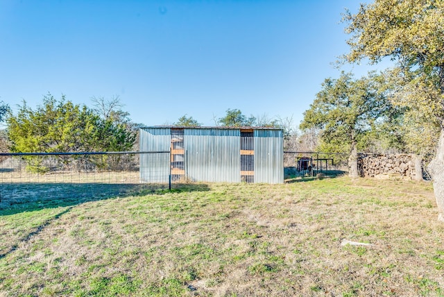 view of outbuilding featuring a yard