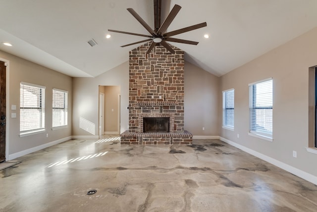 unfurnished living room featuring a large fireplace, vaulted ceiling, and ceiling fan