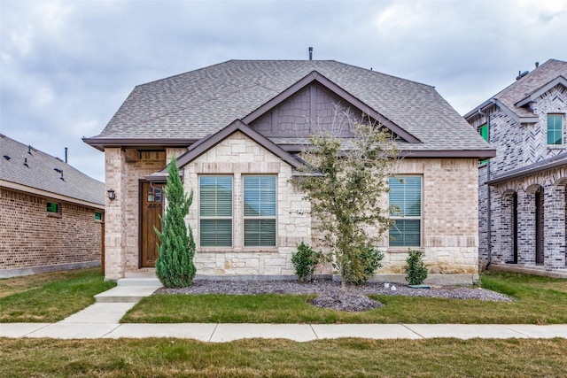 view of front of property with a front lawn