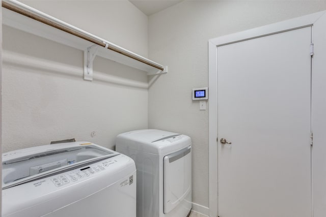 laundry room featuring washing machine and dryer