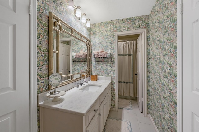 bathroom with vanity and tile patterned floors