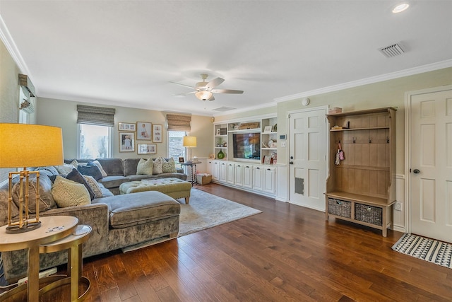 living room featuring crown molding, ceiling fan, and dark hardwood / wood-style flooring