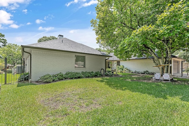 view of side of home featuring a yard