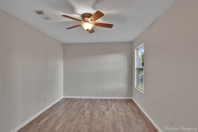 unfurnished room with ceiling fan and light hardwood / wood-style flooring