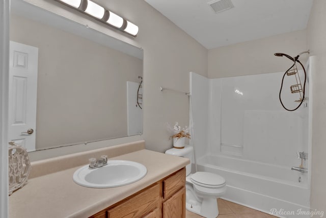 full bathroom with vanity, tub / shower combination, tile patterned floors, and toilet