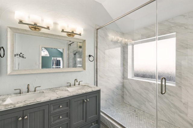 bathroom featuring vanity, an enclosed shower, and lofted ceiling