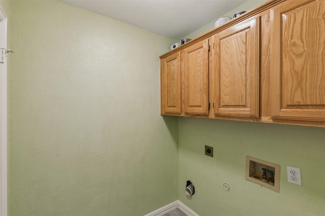 laundry area featuring hookup for an electric dryer, hookup for a gas dryer, cabinets, and washer hookup