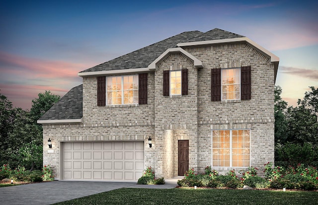 view of front of home with a garage