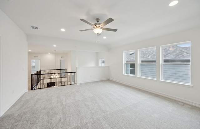 unfurnished room with baseboards, carpet floors, visible vents, and recessed lighting