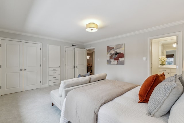 bedroom featuring multiple closets, light colored carpet, and crown molding