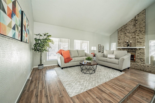 living room featuring hardwood / wood-style floors and high vaulted ceiling