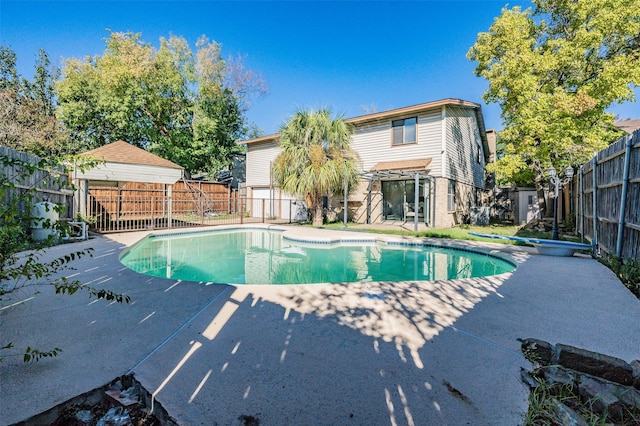 view of swimming pool with a patio area