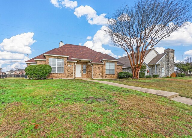 single story home with a front yard