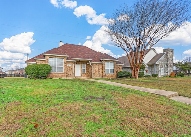 ranch-style house featuring a front yard