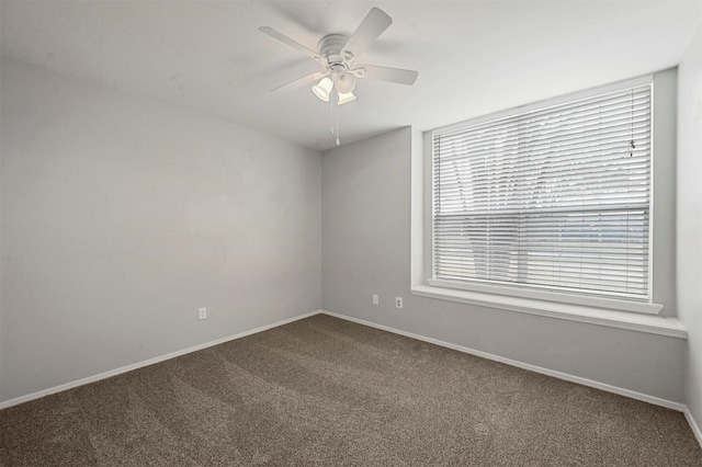 spare room with carpet and ceiling fan