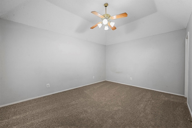 carpeted spare room with lofted ceiling and ceiling fan