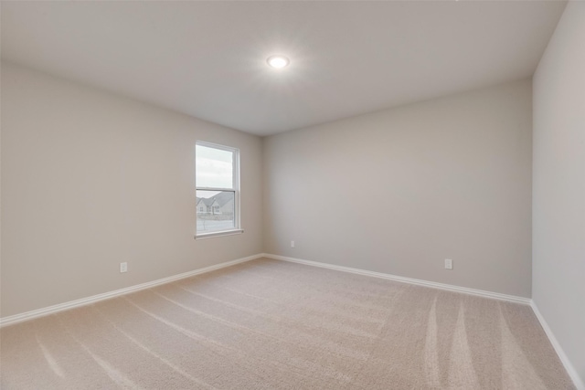 spare room featuring carpet floors