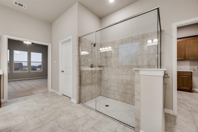 bathroom with tiled shower