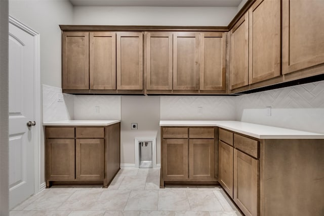 washroom with cabinets and hookup for an electric dryer