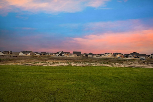 view of yard at dusk