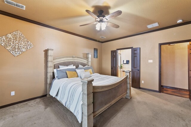 carpeted bedroom with ceiling fan, a textured ceiling, and ornamental molding