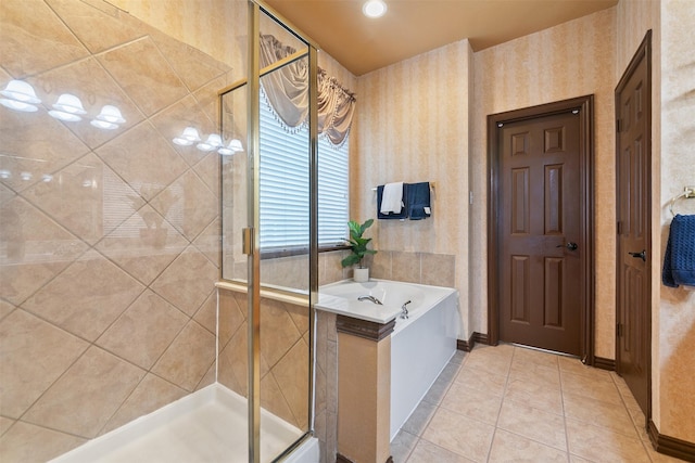 bathroom featuring tile patterned flooring and independent shower and bath