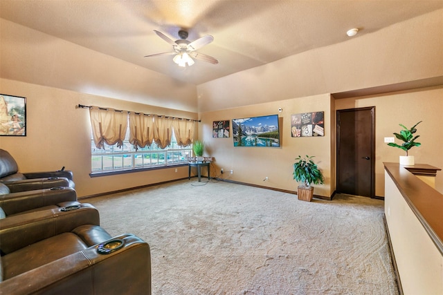 carpeted living room with ceiling fan and lofted ceiling