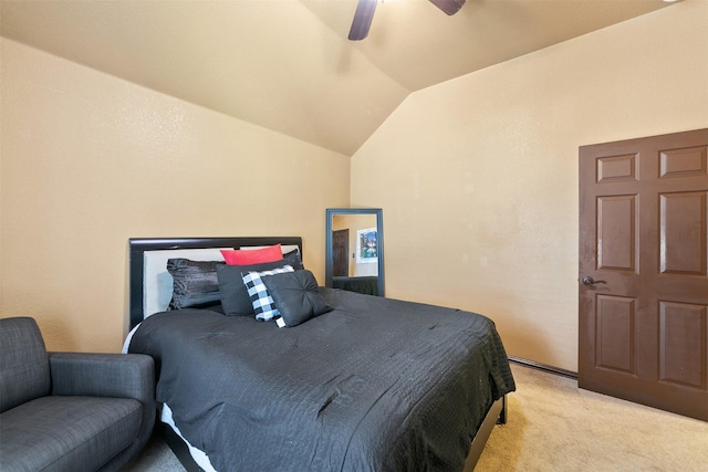 carpeted bedroom with ceiling fan and lofted ceiling