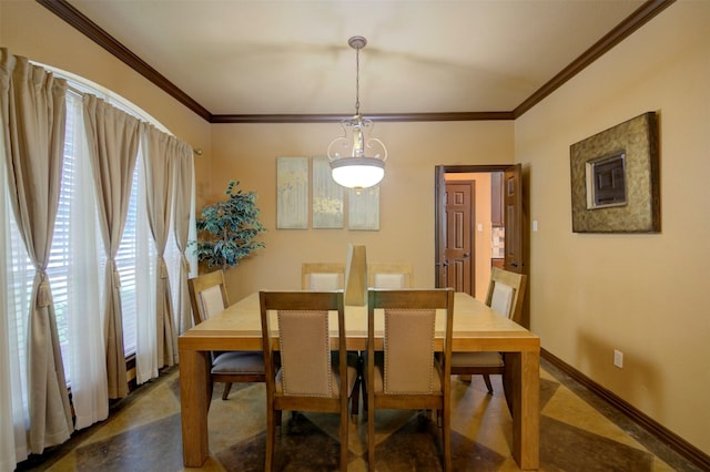 dining space with ornamental molding