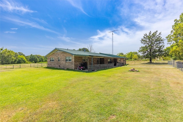 view of yard with a rural view