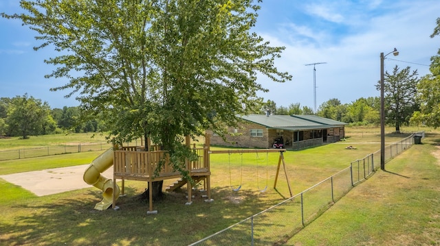 view of yard with a rural view and a playground