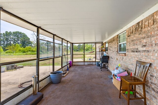 sunroom / solarium featuring plenty of natural light